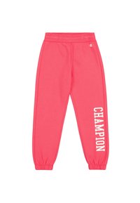 Roze joggingsbroek van zachte stof, met een elastische tailleband en boorden, voorzien van "CHAMPION" in witte letters langs de zijkant.