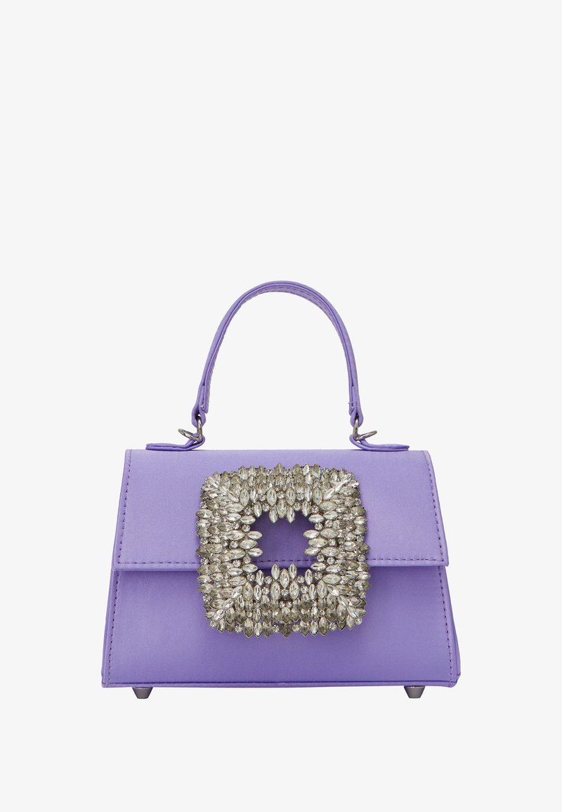 Purple handbag made of smooth material, featuring a large decorative silver brooch on the front, and a structured design with a top handle.