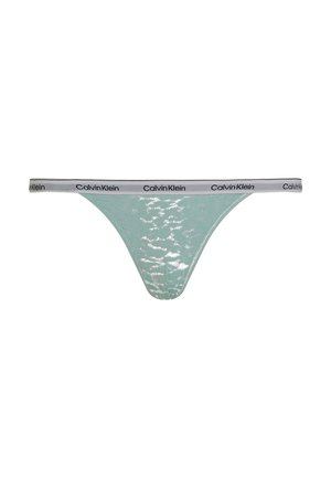 Mintgroene string met een glanzende afwerking en het Calvin Klein-logo op een contrasterende tailleband. Beschikt over een lage tailleontwerp met minimale bedekking.