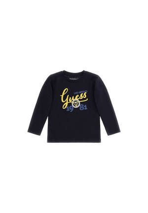 Czarna koszula z długim rękawem z nadrukiem żółto-niebieskiego napisu "Guess Los Angeles 1981" oraz logo na przodzie.