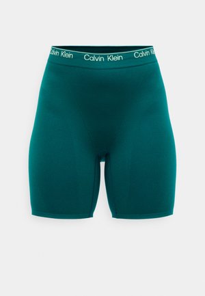 Tyrkysové boxerky ze strečového materiálu s elastickým pasem Calvin Klein. Design je hladký, bez viditelných švů nebo vzorů.