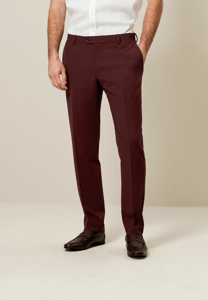 Next MOTIONFLEX - Pantalon - brick red
