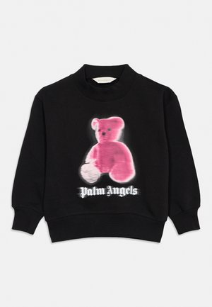 Sweat-shirt noir à col rond avec un graphique d'ours en peluche rose et le texte "Palm Angels" en police gothique blanche sur le devant.