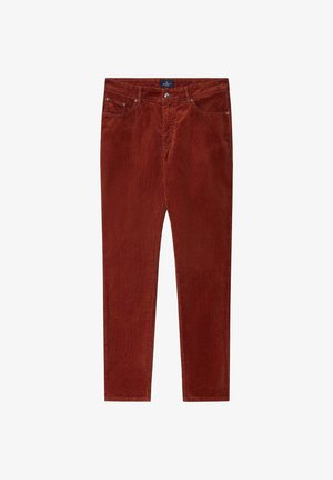 Rostfarbene Cordhosen mit schlankem Schnitt, fünf Taschen und sichtbaren Nähten. Der Stoff hat eine weiche, strukturierte Oberfläche.