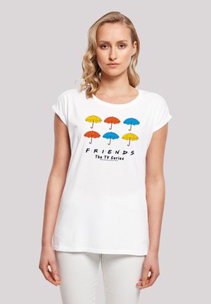 White cotton t-shirt featuring a graphic of seven umbrellas in blue, yellow, orange, and red, with "F.R.I.E.N.D.S" text below. Casual fit.