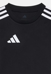 Black athletic t-shirt featuring a round neck, three white stripes on shoulders, and white Adidas logo on the chest. Smooth fabric.