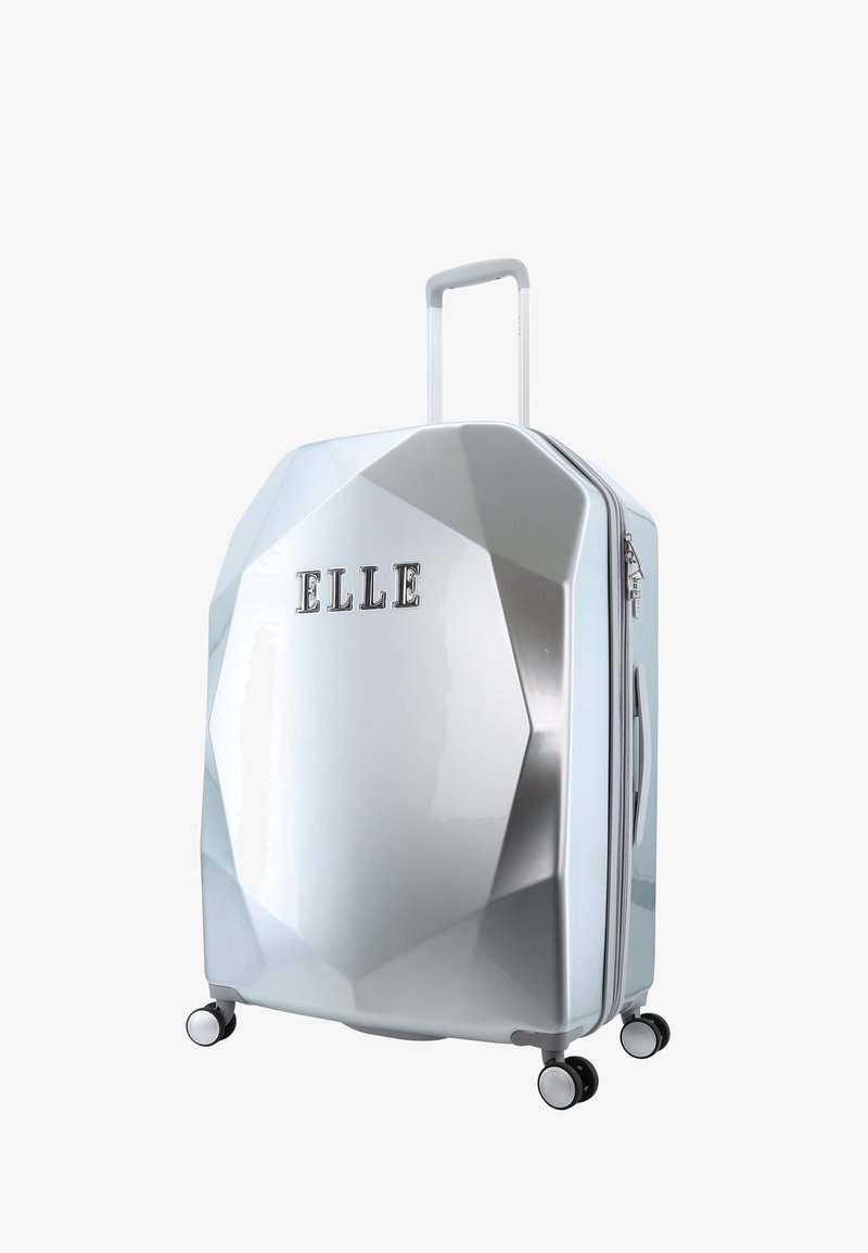 Silver hard-shell suitcase with a geometric design, featuring a extendable handle, dual wheels, and embossed brand name "ELLE."