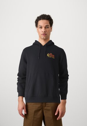 Black hooded sweatshirt with front pocket, featuring red and yellow text emblem. Cotton material with ribbed cuffs and hem.