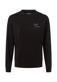 Czarny sweatshirt z miękkiego materiału, z okrągłym dekoltem i długimi rękawami, z białym haftowanym napisem "Good Karma" na piersi.