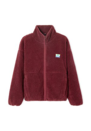 Burgundy fleece jacket with high collar, full zipper, two front pockets, and a small brand patch on the left chest. Soft, textured fabric.