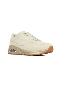 Beżowe sneakersy z gładką syntetyczną cholewką, teksturowanym wzorem, sznurowanym zapięciem oraz amortyzującą podeszwą środkową z widocznym elementem powietrza.