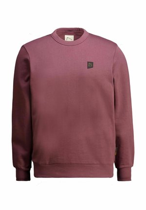 Bordo megztinis su apvalia iškirpte, ilgomis rankovėmis ir mažais juodais logotipo ženkleliais ant krūtinės. Pagamintas iš lygaus, švelnaus audinio.