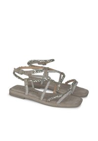 Platte sandalen van grijs suede met sprankelende rhinestone banden. Voorzien van delicate enkelbandjes en een gevoerde voetbed.