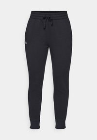 Svarta sweatpants i mjukt tyg, med dragsko i midjan, elastiska manschetter och en liten logotyp på vänster lår.