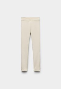 Beżowe legginsy wykonane z miękkiego, elastycznego materiału. Posiadają szeroki, elastyczny pas i dopasowany krój bez widocznych szwów.