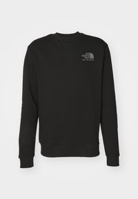 Felpa nera con maniche lunghe, colletto a giro, e polsini a coste. Presenta un piccolo logo grigio sul petto. Realizzata in materiale morbido.