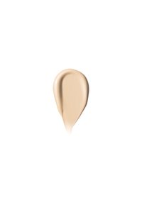 Fondotinta crema beige con una texture liscia e lucida, caratterizzato da una forma a goccia. La tonalità è attenuata, adatta all'abbinamento con il tono della pelle.