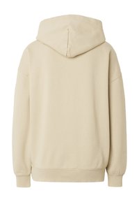Sweat-shirt à capuche beige à manches longues, avec poignets et ourlet côtelés, vu de dos sur fond blanc.
