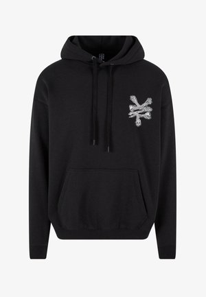 Black hoodie made of cotton blend fabric features a front pocket, drawstring hood, and a silver skull design on the left chest.