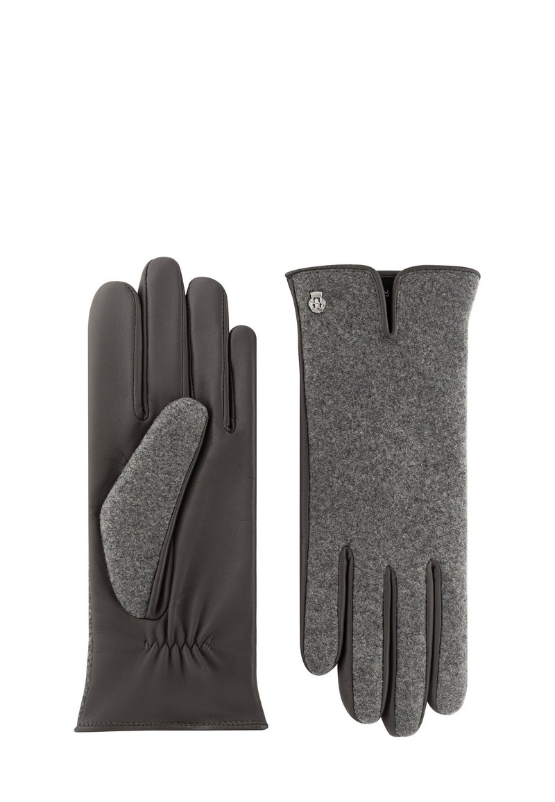 Leder- und Wollhandschuhe mit grauem Wolloberteil, dunkler Lederhandfläche und elastischem Gather am Handgelenk. Silbernes Logo-Acccent auf der grauen Seite.