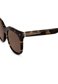 Aurinkolasit kilpikonnakuosisella kehysrakenteella, jotka ovat tummanruskeat linssit, paksu kehys, kultaketjut ja kaiverrus "Kapten & Son" templeissa.