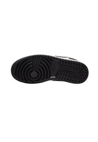 Svart gummisula till sneakers med texturerade cirkulära och linjära mönster, med en central cirkulär pivot och Nike-logotyp.