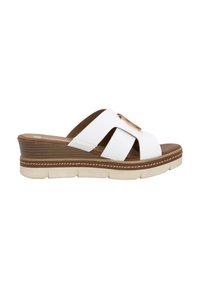 White platform slide sandal with wide cross straps, brown footbed, and textured sole. Features a gold-tone metal accent on strap.