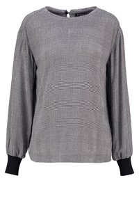 Blusa a maniche lunghe a scacchi bianco e nero con scollatura rotonda, polsini neri elasticizzati e chiusura con bottone sul retro.