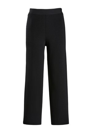 Pantalons larges noirs en tissu doux et texturé. Dotés d'une taille élastique lisse et d'un design long. Sans motifs ni accents.