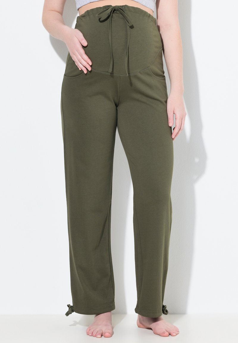Olivově zelené, měkké kalhoty ze tkaniny s vysokým elastickým pasem, stahovací šňůrkou, bočními kapsami a nastavitelnými tkanicemi na lemu.