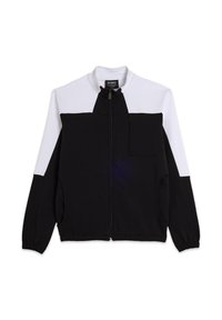 Chaqueta negra y blanca con cremallera y cuello alto, que cuenta con un bolsillo en el pecho, bolsillos laterales y puños acanalados. Fabricada con tela suave.