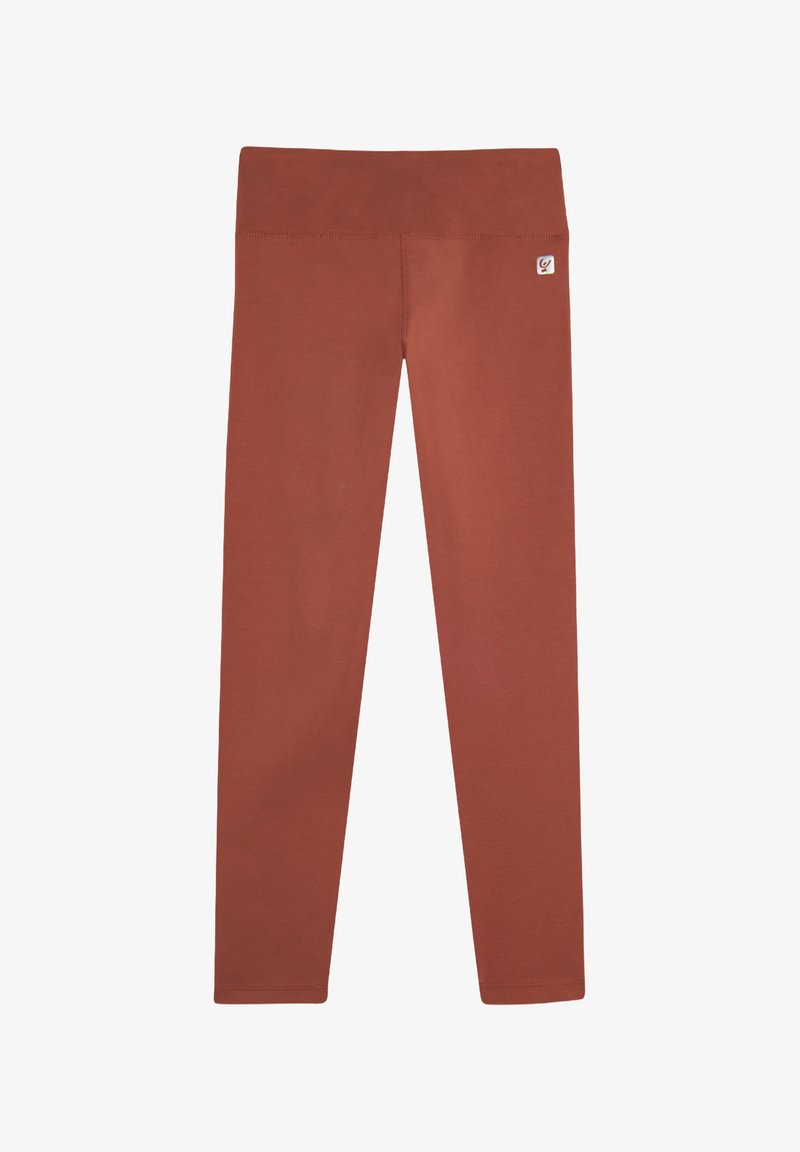 Leggings color ruggine realizzati in un tessuto liscio e elastico, dotati di una ampia vita elastica e di un piccolo logo sul lato dell'anca.