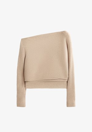 Beżowy sweter ze specjalnym prążkowanym wzorem, o asymetrycznym kroju, z długimi rękawami i skróconym fasonem. Miękka tekstura z lekkim stretch.