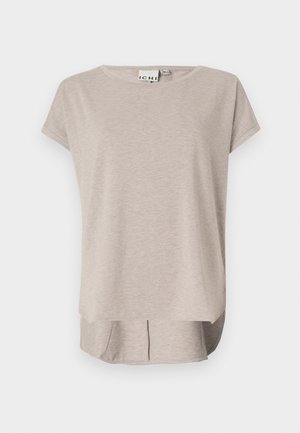 Világos bézs, rövid ujjú póló, puha anyagból készült. Lekerekített nyakú, laza szabású, hátulja kicsit hosszabb, az oldalsó részeken hasítékokkal.