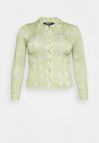 Camisa de botão de manga longa em verde claro e branco com um padrão floral. Apresenta um colarinho e um tecido texturizado.