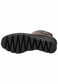 Semelle de bottes en cuir marron avec caoutchouc noir texturé présentant un motif en zigzag pour l'adhérence. Comprend un petit logo imprimé près du talon.