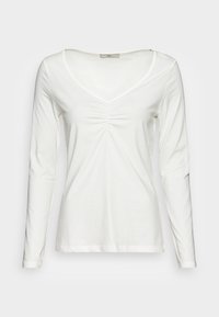 Witte lange mouwen shirt met een V-hals en geplooid detail aan de voorkant. Gemaakt van zachte, lichte stof met een gladde textuur.