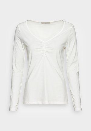 Biała koszula z długim rękawem, z dekoltem w kształcie litery V i marszczeniem z przodu. Wykonana z miękkiego, lekkiego materiału, o gładkiej fakturze.