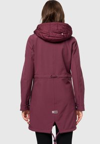Maroon waterproof jacket with a quilted hood, drawstring waist, and side slits. Features snap buttons and a logo tag near the hem.
