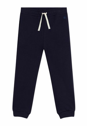 Marineblaue Jogginghose aus weichem Stoff, mit einem elastischen Bund und einer cremefarbenen Kordel sowie schmal zulaufenden Bündchen. Zwei seitliche Taschen vorhanden.