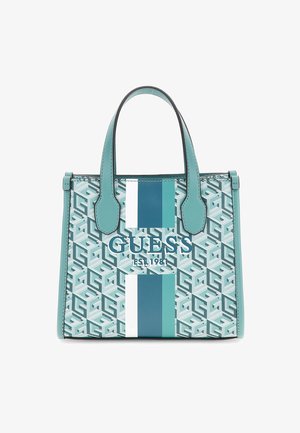 Torebka Structured Guess z uchwytami w kolorze teal, wzór geometryczny oraz pionowe białe, teal i ciemnoturkusowe paski na przodzie.