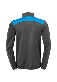 Grijze jas met lange mouwen, met een blauwe schouderpaneel. Soepele, waterafstotende stof en een hoog kraagontwerp.