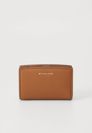 Brown leather wallet with visible texture, folded design, and gold logo detailing on the front. Compact and rectangular shape.