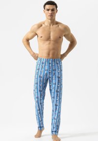 Blaue Pyjamahose mit einem verspielten Muster aus Fahrrädern und Hunden, mit einem elastischen Bund und lockerem Schnitt. Glatte Stoffstruktur.