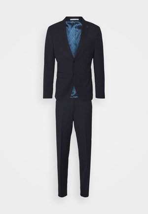 Marine pak met een enkel-breasted jasje, voorzien van twee knopen, twee voorkeptassen en een gestreepte blauwe voering. Smalle broeken maken de set compleet.