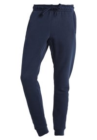 Mörkblå sweatpants av bomullsmix; har elastisk midja med snörning, två sidofickor och ribbade ärmslut.