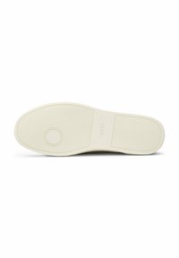 White rubber sneaker sole featuring a textured grip pattern and subtle embossed logo detailing. Smooth, rounded toe design.