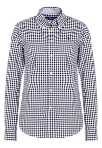 Camicia a quadri in bianco e nero con maniche lunghe, colletto a punta e bottoni bianchi. Presenta un piccolo logo sul lato sinistro del petto.