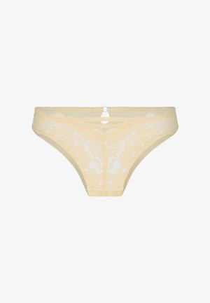 Sous-vêtements bikini en dentelle beige avec des motifs floraux et un détail de fine bride au centre de la taille.