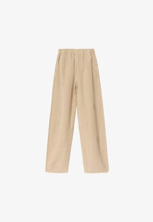 Beige vidde bukser med elastik i taljen og sidelommer, lavet af letvægtsstof.